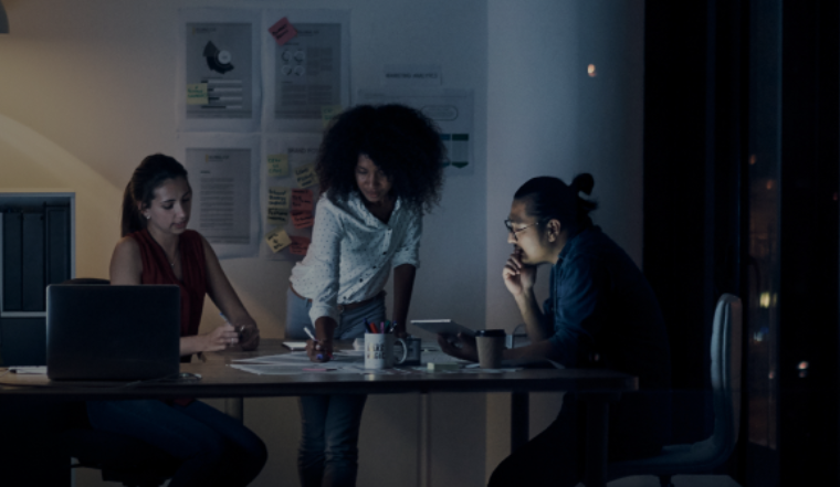 A group of employees working at night.