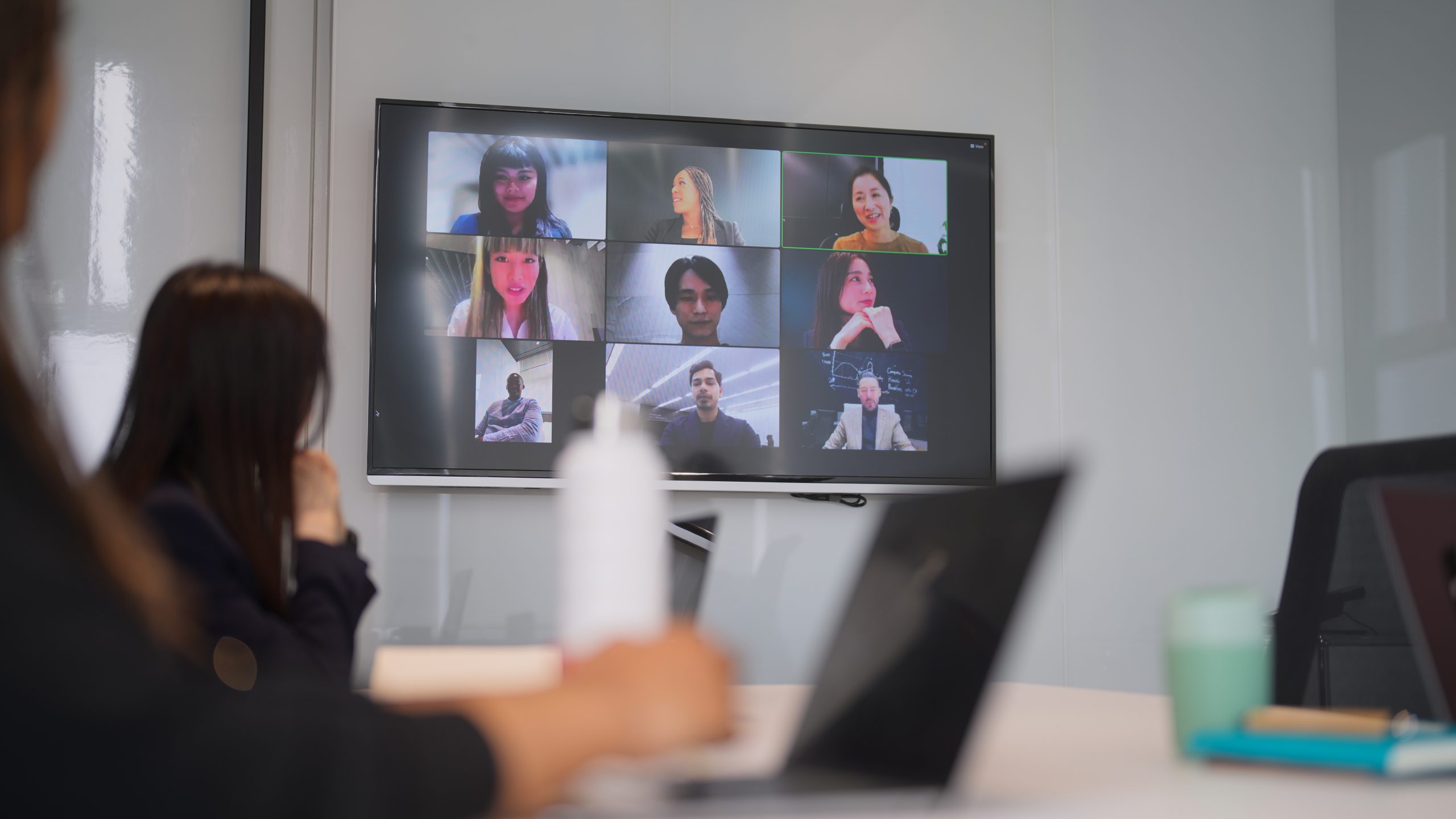 Group of business people joining online business conference meeting in office