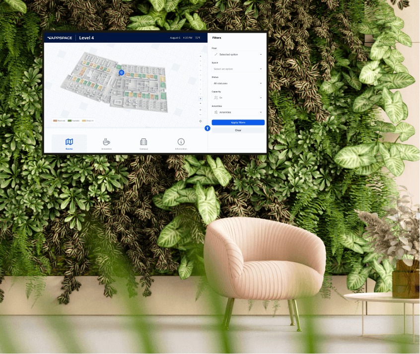 Lobby with plant wall and a digital sign showing office space