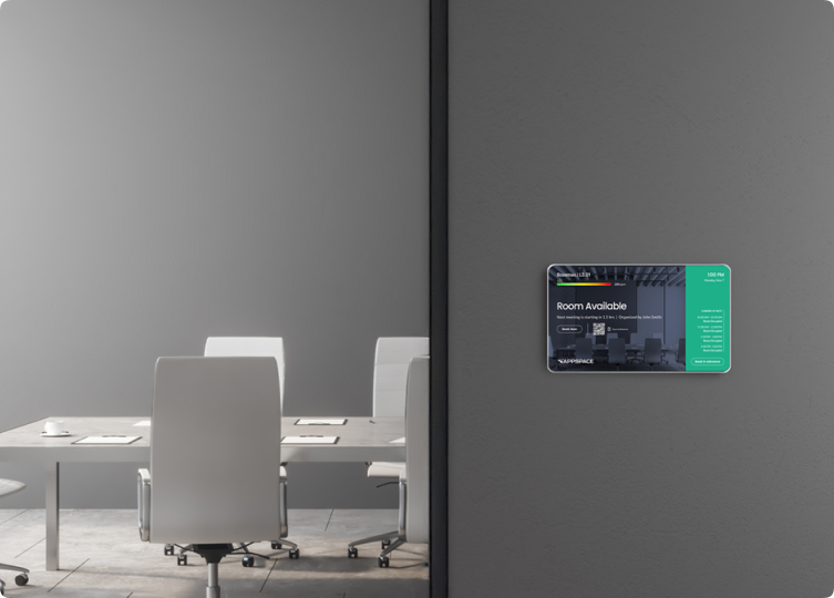 Modern conference room with a room booking kiosk on the exterior wall.