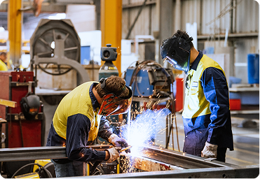 Industrial workers welding