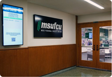 Interior office with MSU FCU logo on a digital sign