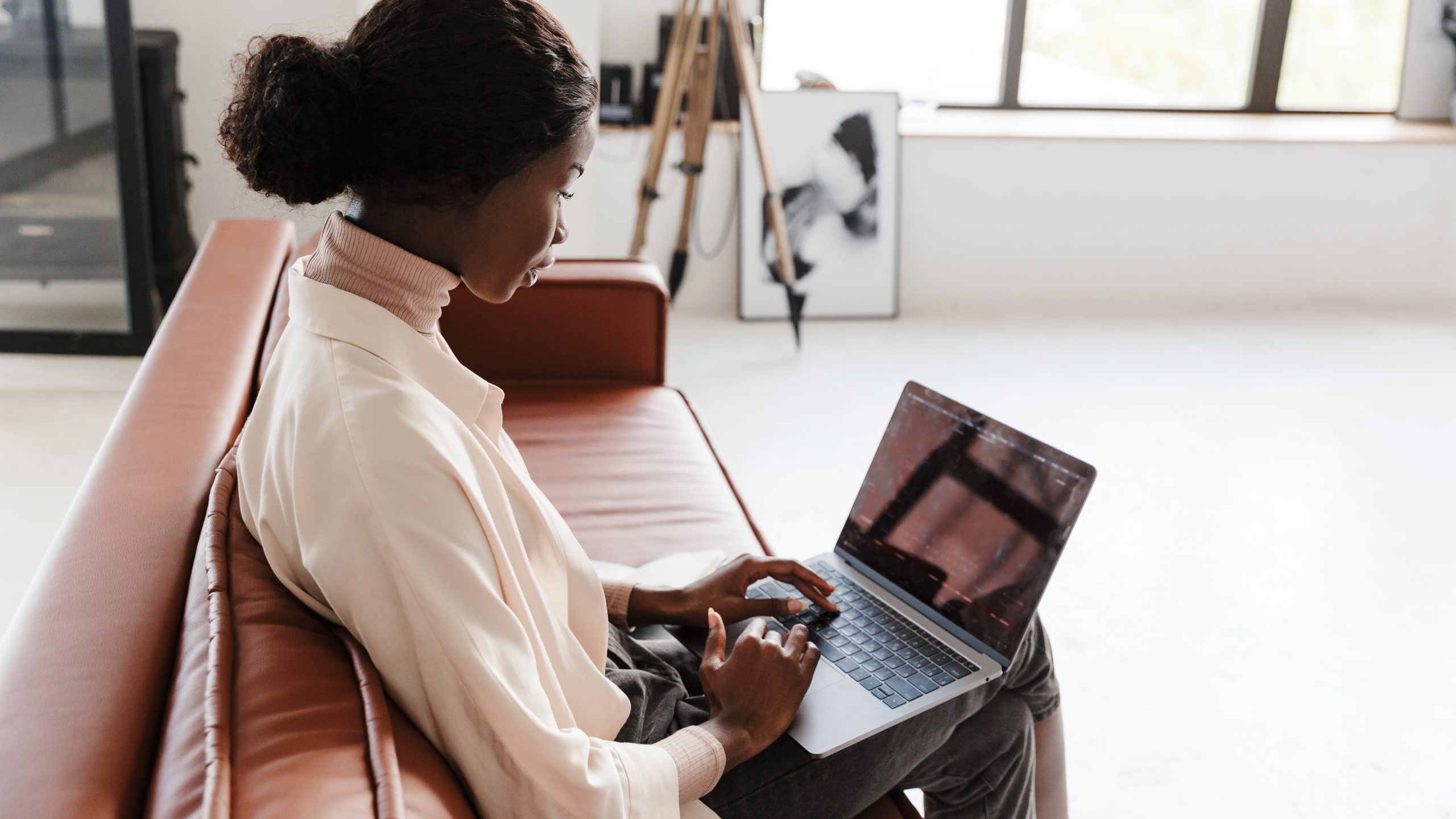 Hybrid worker working from her laptop