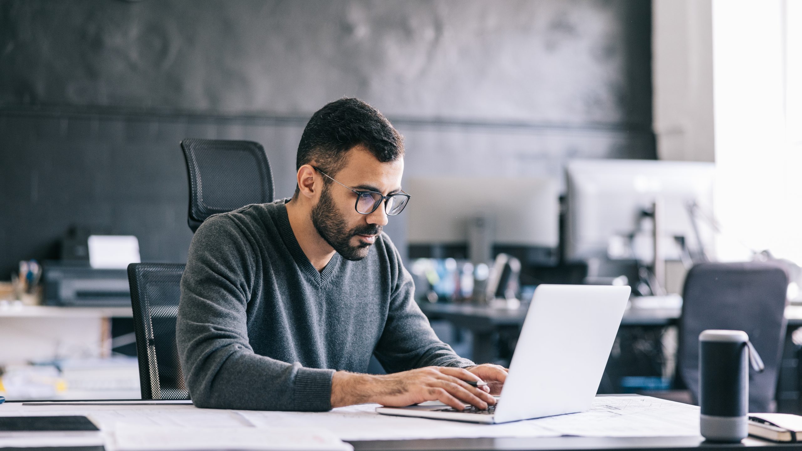 Workforce employee uses workplace tools that work in sync across platforms like desktop, mobile and messaging apps